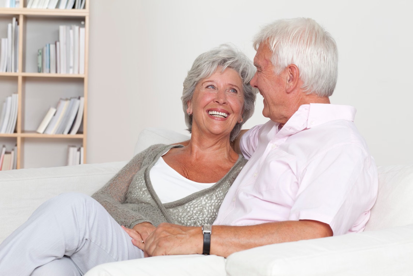 Senior couple smiling together at home
